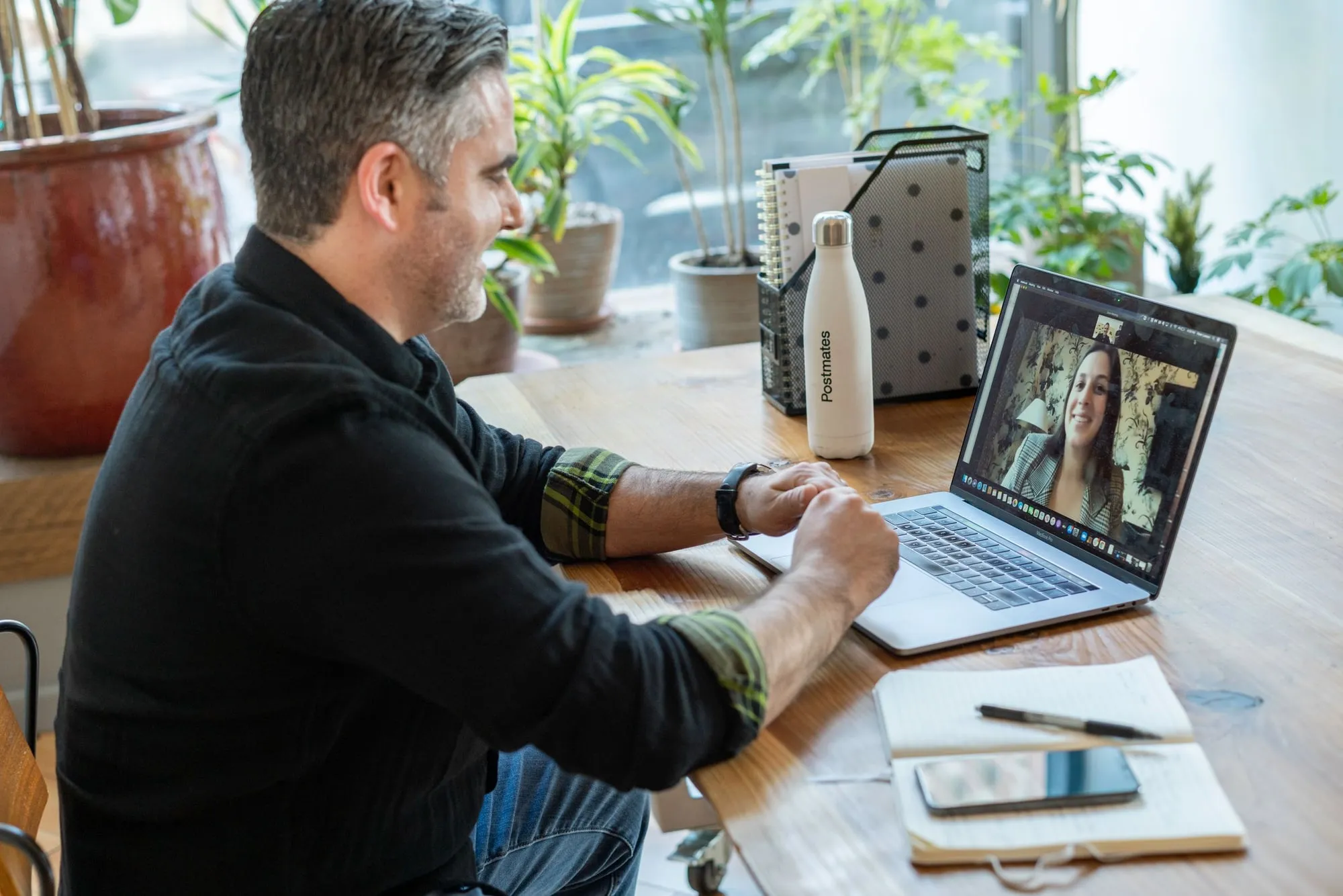 A man in a video call at his desk